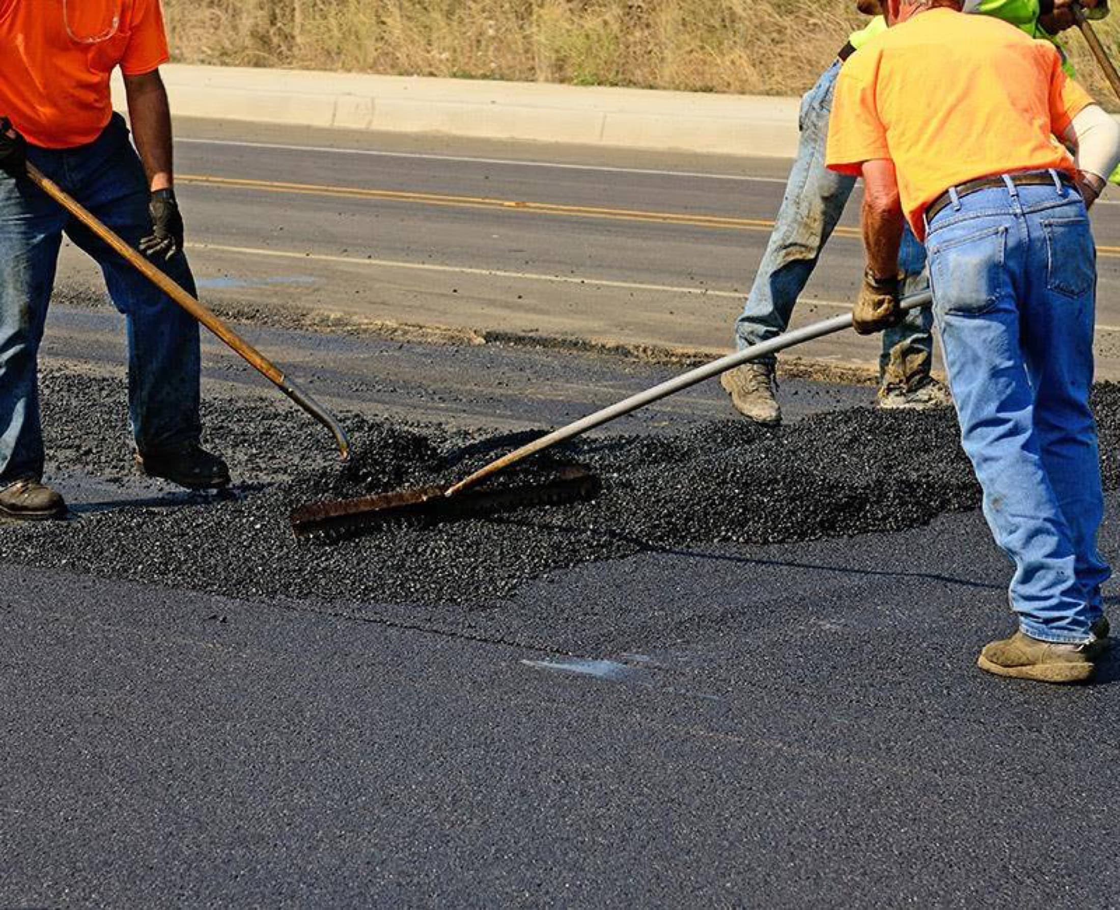 Asphalt patching hand rake crew