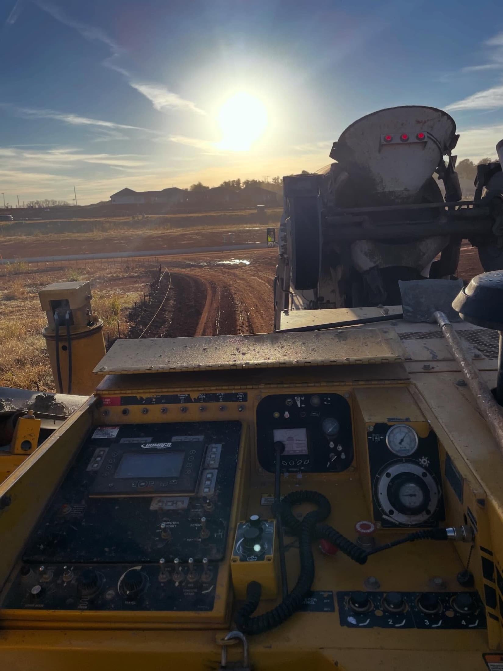 Concrete paving operator pov sunrise