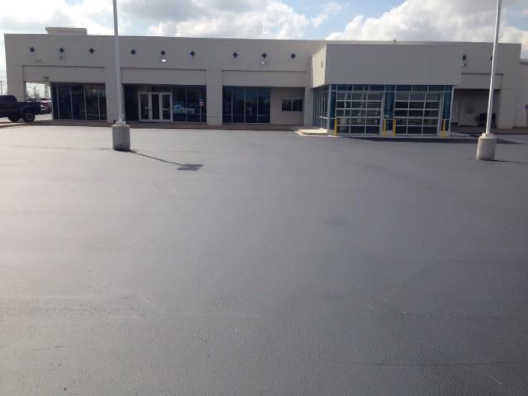 Sealcoating commercial lot dealership