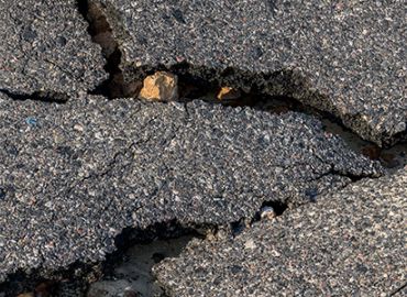 Water Damage & Cold Weather Repair for Asphalt Pavement